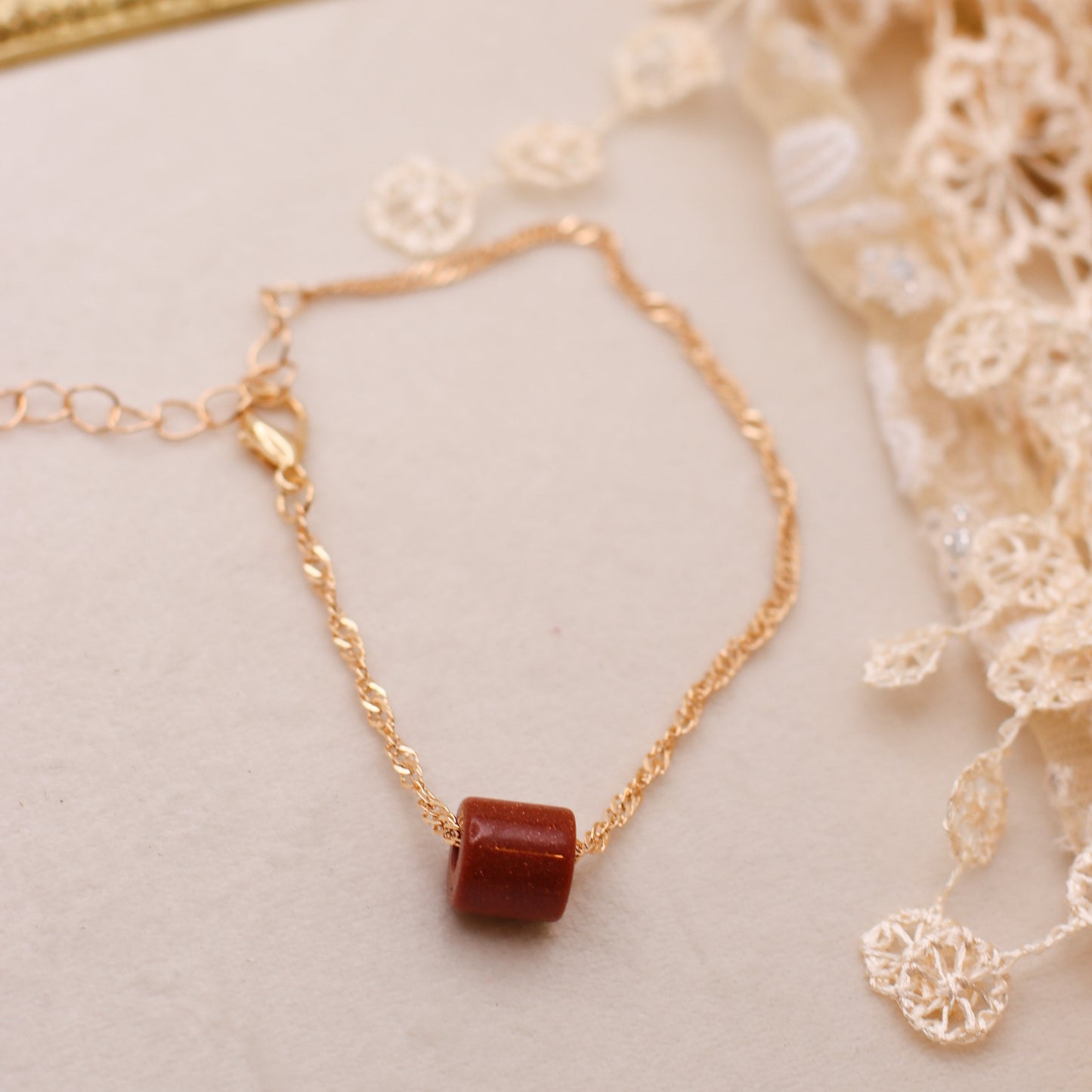 Goldstone & Gold Colored Spiral Chain Bracelet