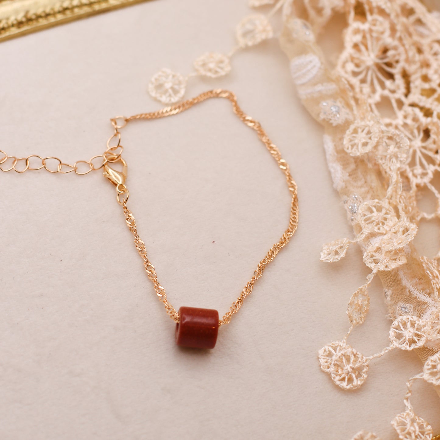 Goldstone & Gold Colored Spiral Chain Bracelet