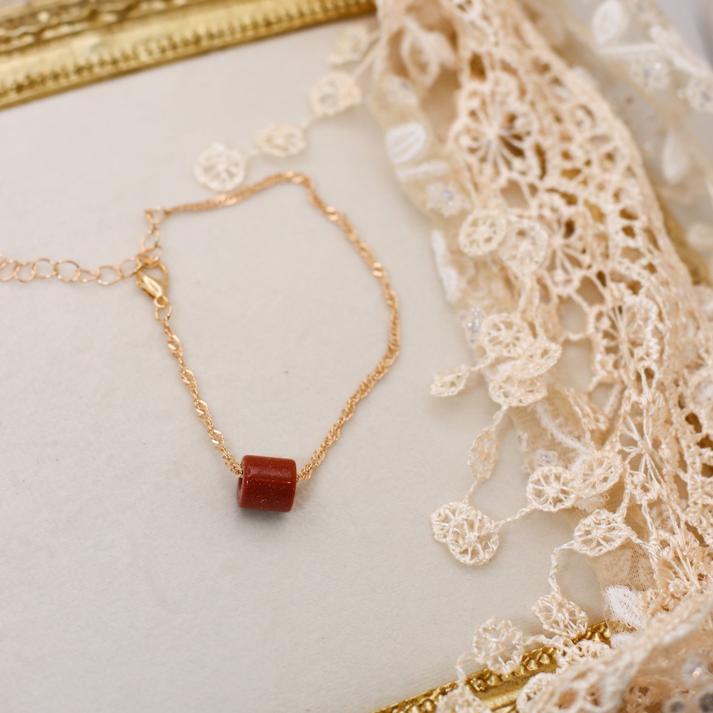 Goldstone & Gold Colored Spiral Chain Bracelet